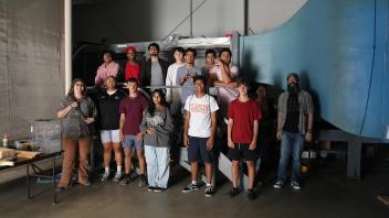 Group picture of students visiting the wind tunnel